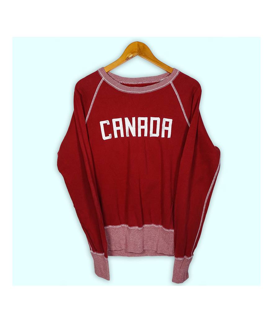 Sweat Canada bordeaux, grand logo brodé à l'avant. Elastiques larges aux manches et à la taille.